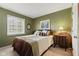 Lovely bedroom with a cozy bed, framed artwork, and a sunny window for natural light at 13892 Adios Pass, Carmel, IN 46032