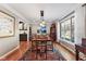 Elegant dining room with hardwood floors, stylish lighting, and ample space for entertaining at 13892 Adios Pass, Carmel, IN 46032
