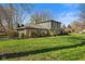 Two-story home exterior featuring stone and siding, lush landscaping, and an attached two-car garage at 13892 Adios Pass, Carmel, IN 46032