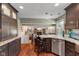 Gourmet kitchen features granite countertops, bar seating, and open access to the adjacent living space at 13892 Adios Pass, Carmel, IN 46032
