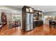 Well-appointed kitchen showcasing stainless appliances, custom cabinetry, and a view to the adjacent dining area at 13892 Adios Pass, Carmel, IN 46032