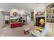 Cozy living room features a fireplace, built-in shelving, and a large television at 13892 Adios Pass, Carmel, IN 46032