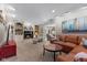 Cozy living room with a fireplace, custom built-ins, and comfortable seating arrangement at 13892 Adios Pass, Carmel, IN 46032