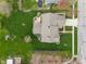 Aerial view highlighting the expansive backyard, patio with a fire pit, and lush green lawn, perfect for outdoor enjoyment at 14910 Declaration Dr, Westfield, IN 46074