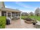Expansive backyard featuring a patio, fire pit, green lawn, and beautiful landscaping at 14910 Declaration Dr, Westfield, IN 46074