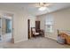 Bedroom with ceiling fan, and a view of a hallway at 14910 Declaration Dr, Westfield, IN 46074