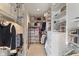 Spacious walk-in closet with custom shelving and ample storage space for clothes and accessories at 14910 Declaration Dr, Westfield, IN 46074