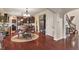 Charming dining area featuring a round table, decorative chandelier, and hardwood floors at 14910 Declaration Dr, Westfield, IN 46074