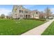 A well-manicured lawn complements this two-story house with an attached two-car garage at 14910 Declaration Dr, Westfield, IN 46074