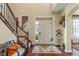 Inviting foyer with hardwood floors, a staircase, and a view to the front door at 14910 Declaration Dr, Westfield, IN 46074