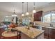 Spacious kitchen with stainless appliances, island, and open dining area at 14910 Declaration Dr, Westfield, IN 46074