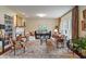 Inviting living room with a fireplace, built-in shelving, and elegant furnishings at 14910 Declaration Dr, Westfield, IN 46074