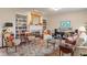 Cozy living room with a fireplace, built-in shelving, and plush seating at 14910 Declaration Dr, Westfield, IN 46074
