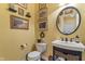 Cozy powder room with decorative mirror, elegant fixtures, and tasteful wall decor at 14910 Declaration Dr, Westfield, IN 46074