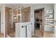 Elegant glass-enclosed shower with tile surround and convenient access to a walk-in closet at 14910 Declaration Dr, Westfield, IN 46074