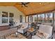 Inviting sunroom featuring a ceiling fan, outdoor views, stone floors, and comfortable seating at 14910 Declaration Dr, Westfield, IN 46074