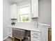 Bright office nook with white cabinets and drawers and a large window providing natural light at 15341 Montfort Dr, Noblesville, IN 46062