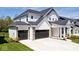 Beautiful two-story home with a three-car garage, attractive stonework, and well-maintained landscaping at 15341 Montfort Dr, Noblesville, IN 46062