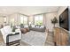 Inviting living room with comfortable seating, natural light, stylish decor, and hardwood flooring at 15341 Montfort Dr, Noblesville, IN 46062