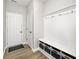 Organized mudroom with coat hooks, storage cubbies, and a bench, offering practical space and a welcoming entry at 15341 Montfort Dr, Noblesville, IN 46062