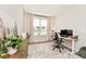 Well-lit home office with modern desk, comfortable chair, and view of neighborhood at 15341 Montfort Dr, Noblesville, IN 46062