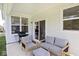 Cozy outdoor patio featuring comfortable seating, a grill, and sliding glass doors to the indoors at 15341 Montfort Dr, Noblesville, IN 46062