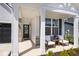 Inviting front porch with comfortable seating and stylish accents at 15341 Montfort Dr, Noblesville, IN 46062