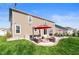 A sprawling backyard features a patio with an outdoor seating area and firepit at 15762 Hargray Dr, Noblesville, IN 46062