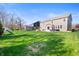Wide-open backyard featuring patio, outdoor furniture, expansive lawn, and playset at 15762 Hargray Dr, Noblesville, IN 46062