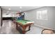 Spacious finished basement with a pool table, basketball game and concrete floors at 15762 Hargray Dr, Noblesville, IN 46062