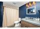 Bathroom with gray countertop, neutral shower curtain, and modern fixtures at 15762 Hargray Dr, Noblesville, IN 46062