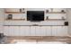 Stylish built-ins and shelves adorn the living room, complemented by sleek cabinets at 15762 Hargray Dr, Noblesville, IN 46062