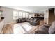 Bright living room with hardwood floors, large windows, and a spacious seating area at 15762 Hargray Dr, Noblesville, IN 46062