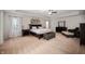 Spacious main bedroom with carpet, fan, tray ceiling, sitting area, and plentiful natural light at 15762 Hargray Dr, Noblesville, IN 46062