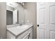 Bright bathroom featuring a single sink vanity with storage, a large mirror, and neutral wall paint at 1614 Ashley Dr, Lebanon, IN 46052
