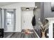Stylish home foyer with white door, modern decor, and wood-look floors offers a welcoming entrance at 1614 Ashley Dr, Lebanon, IN 46052