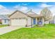 Charming single-Gathering home with a brick facade, attached garage, and inviting front yard at 1614 Ashley Dr, Lebanon, IN 46052
