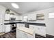 Bright kitchen with white cabinets, butcher-block island, stainless steel appliances and ample counter space at 1614 Ashley Dr, Lebanon, IN 46052