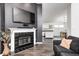 Living Room showcasing the fireplace, modern layout, and open floor plan at 1614 Ashley Dr, Lebanon, IN 46052