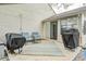 An outdoor patio with seating and barbecue grills, ideal for entertaining at 1614 Ashley Dr, Lebanon, IN 46052