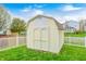 A wooden shed in the backyard, offering extra storage space at 1614 Ashley Dr, Lebanon, IN 46052