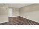 Finished basement with hardwood floors and a white interior door at 17269 Dallington St, Westfield, IN 46074