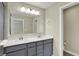 Bathroom featuring double vanity with grey cabinets and a large mirror at 17269 Dallington St, Westfield, IN 46074
