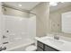 Bathroom with white tub and shower combo, toilet, sink, and mirror at 17269 Dallington St, Westfield, IN 46074