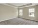 Bedroom with neutral carpet, two windows, and trey ceilings at 17269 Dallington St, Westfield, IN 46074
