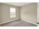Bright bedroom features neutral walls, carpet, and a window providing natural light at 17269 Dallington St, Westfield, IN 46074