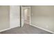 Bedroom with neutral walls and carpet with an open white door at 17269 Dallington St, Westfield, IN 46074
