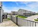 Deck overlooking street with townhouse-style homes and landscaped lawns at 17269 Dallington St, Westfield, IN 46074
