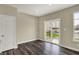 A light-filled dining area with wood-look floors and sliding door access to the outdoor patio at 17269 Dallington St, Westfield, IN 46074