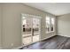 A light-filled dining area with wood-look floors and sliding door access to the outdoor patio at 17269 Dallington St, Westfield, IN 46074